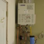 Tankless water heater with hot water return