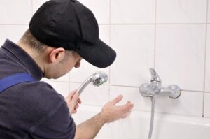Plumber controls water flow