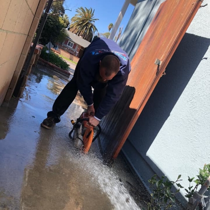 plumber fixing flooded home after broken pipes