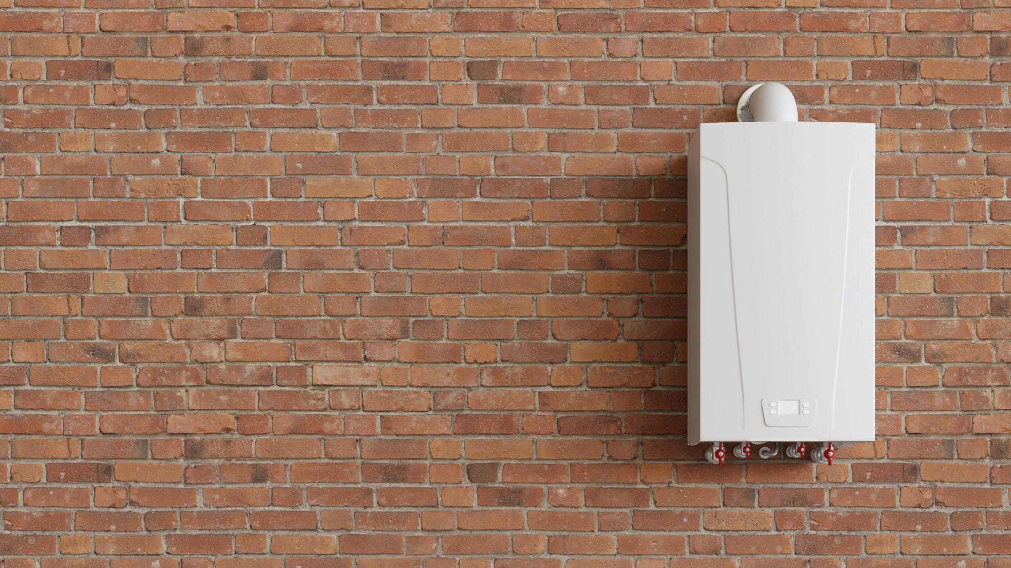 A tankless water heater attached to a brick wall