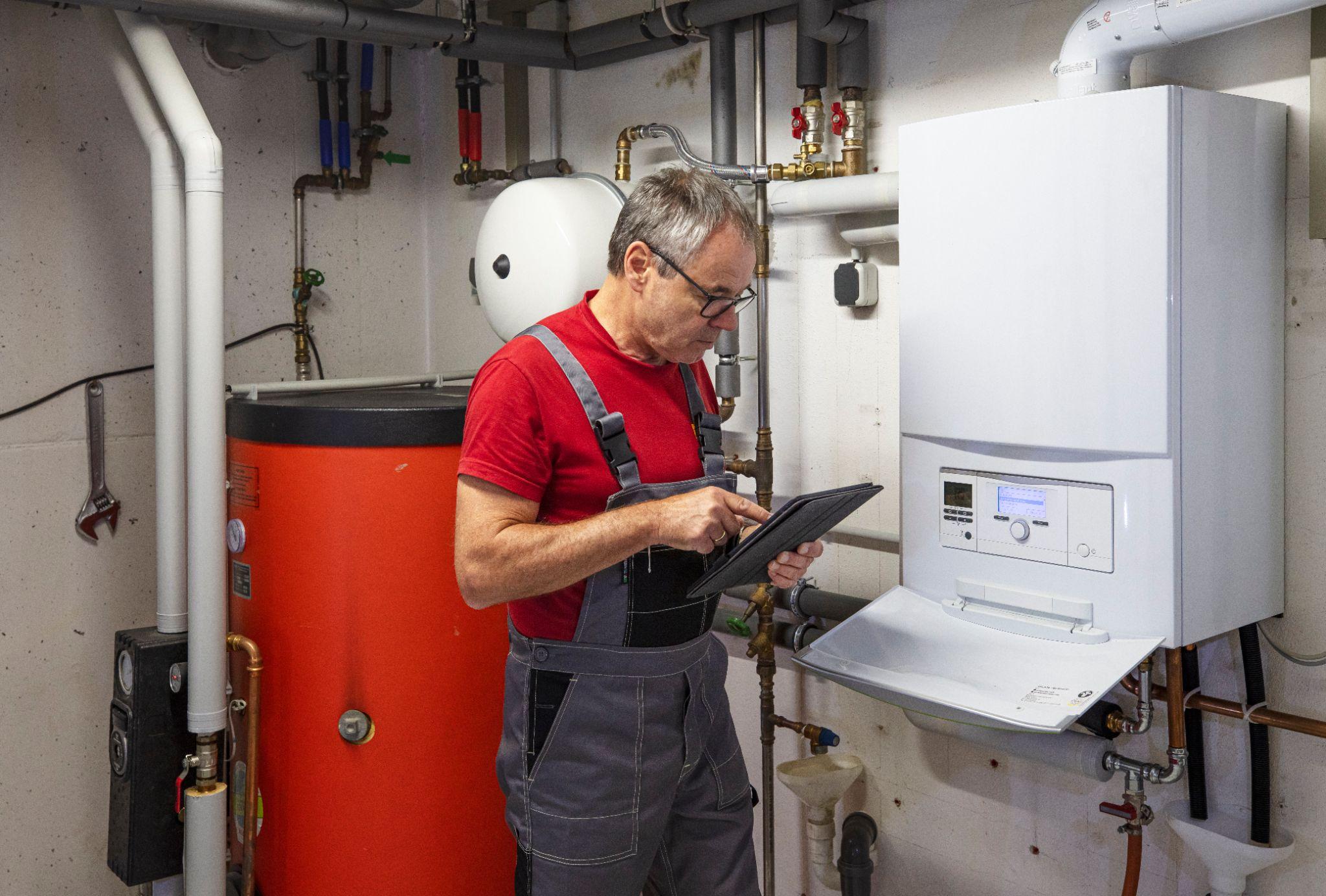 Technician adjusts heating