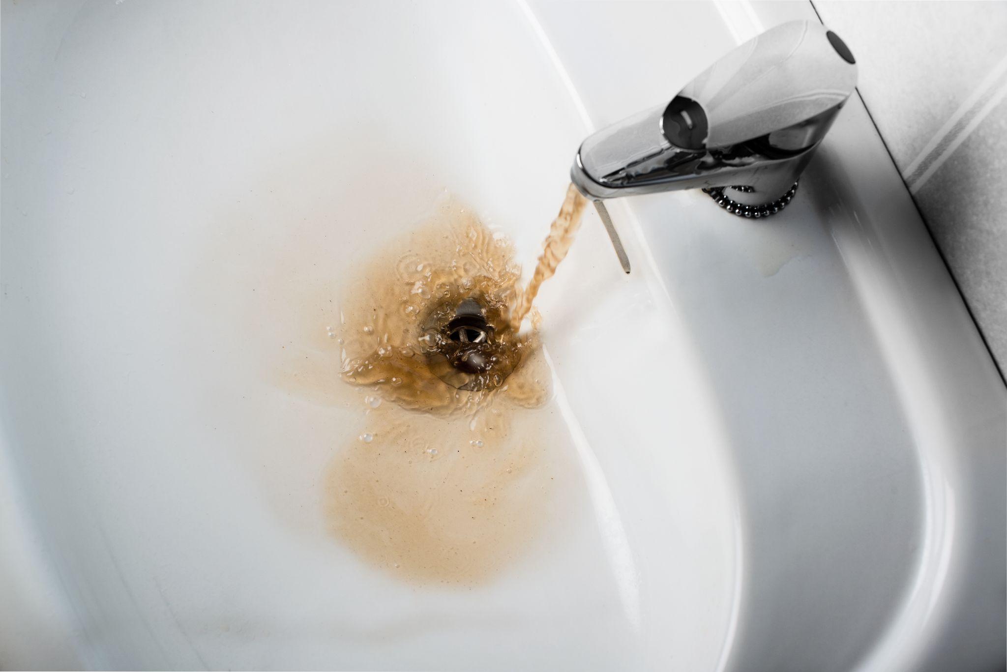 Brown water coming out of a faucet