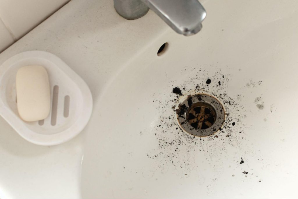 A backed up drain in a sink
