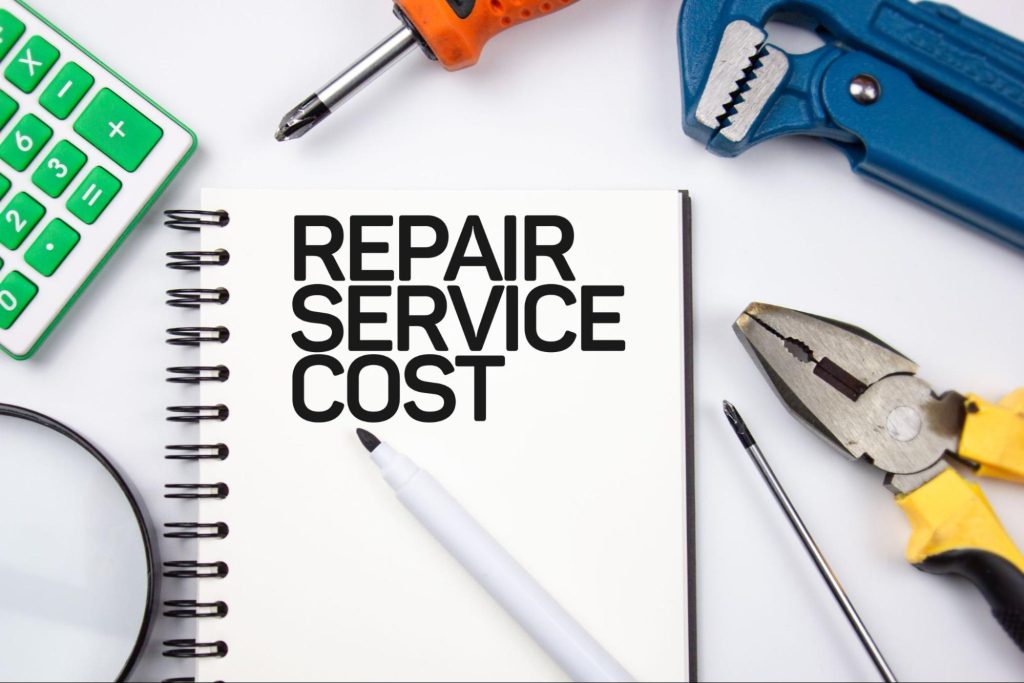 COST REPAIR - text concept on a notepad on the background of tools. Repair cost.
